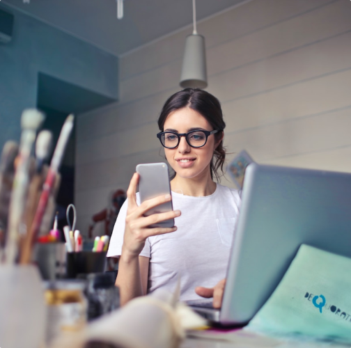 Girl looking at her phone in excitement