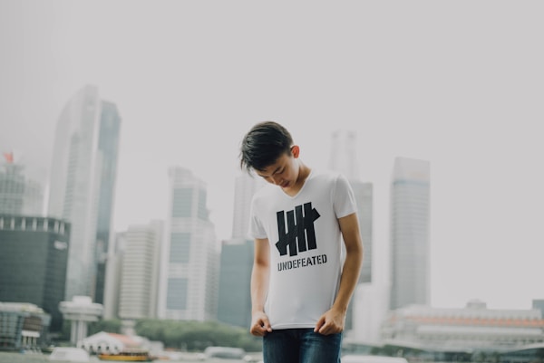 Image of a man wearing a brand t-shirt